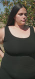 Woman wearing black ribbed tank