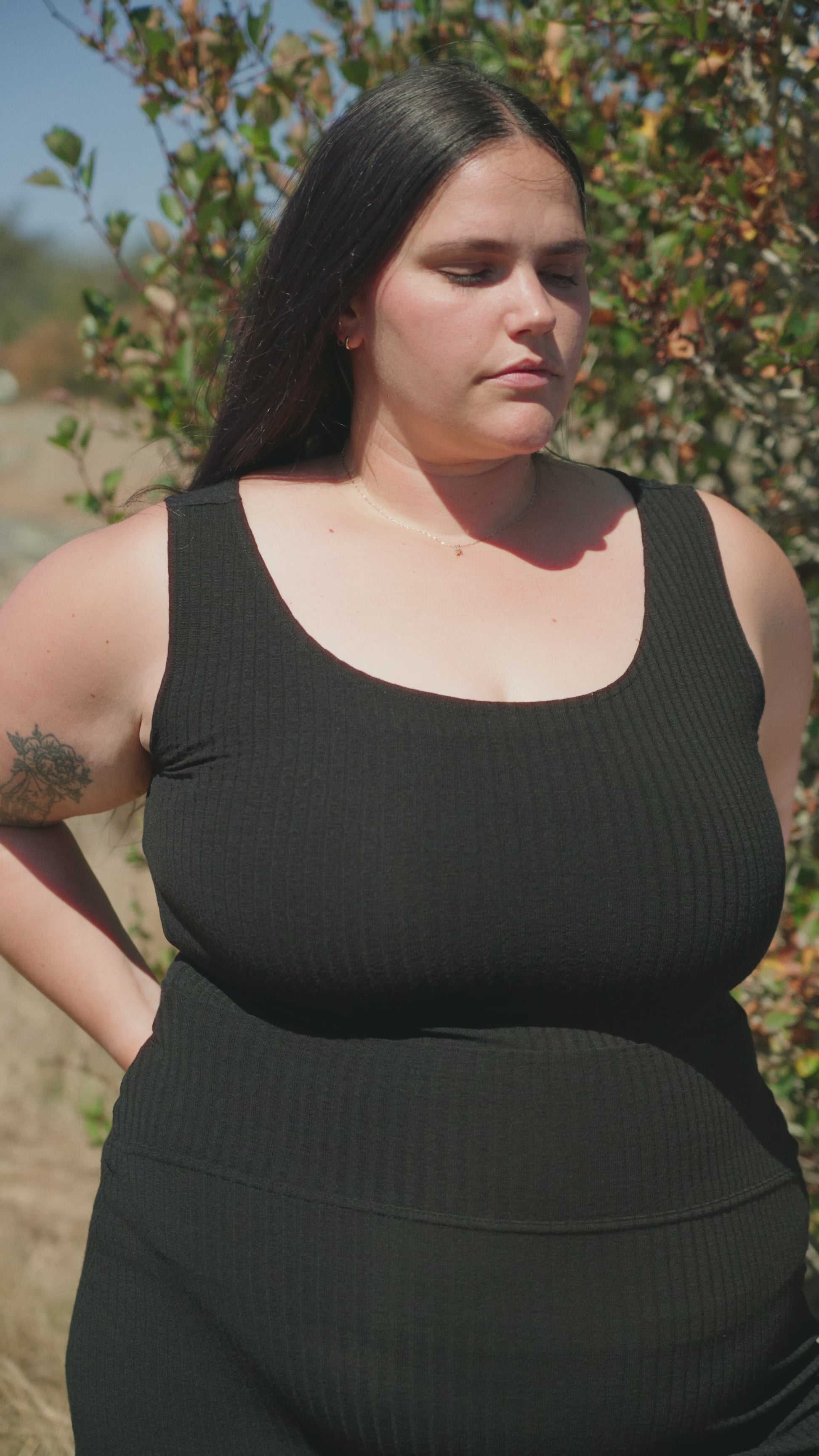 Woman wearing black ribbed tank